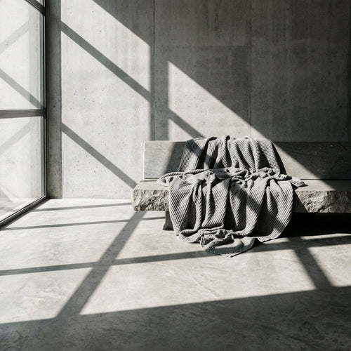 Monolith Ash Grey waffle throw styled